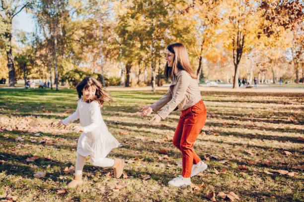 istock Mother enjoy with daughter in park 2203266343