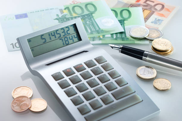 istock Calculator with Euro coins and banknotes 2203266852