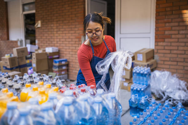istock Retail Worker Unpacking Beverage Pallet Behind Supermarket 2203266959