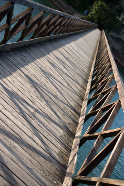 Wooden bridge over a river in dynamic diagonal perspective