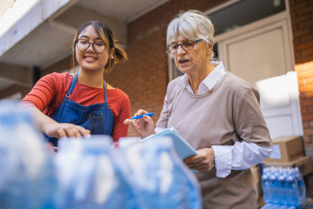 istock Senior Manager and Employee Inspecting Inventory 2203268047