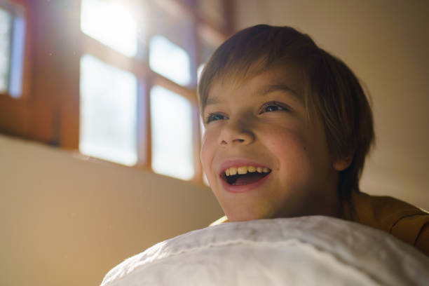 istock Boy lies on the pillow during the morning 2203268425