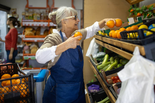 istock Retail Worker Sorting Fresh Produce in Supermarket 2203268801