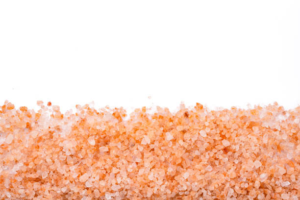 istock Organic himalayan pink salt on white background 2203270842
