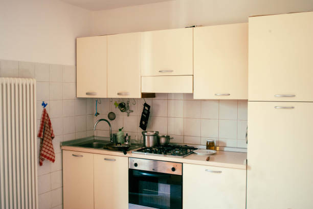 istock Empty kitchen showing signs of recent use with dirty dishes 2203271833