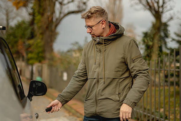istock Young Attractive Man With A Car On A Street 2203272893