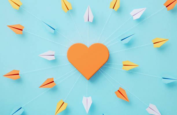 istock Paper Planes And Orange Heart Shape Which Are Connected By Dotted Lines On Blue Background 2203276038