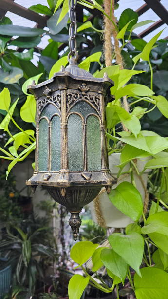 istock Decorative lantern in the winter garden 2203278413