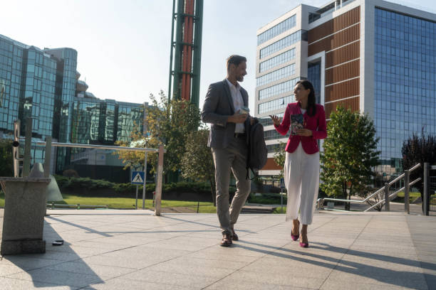 istock Two colleagues walking to the office 2203278721