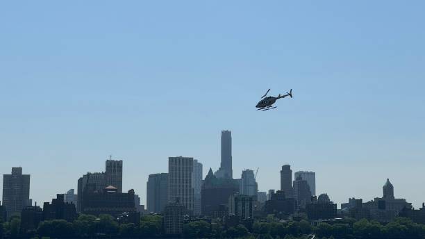 istock Dynamic NYC street view with helicopter on the sky 2203279852