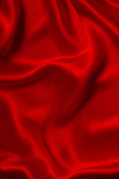istock Red silk or satin luxury fabric texture can use as abstract background. 2203281246