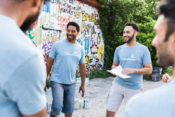 istock Volunteers working together on a community project 2203282620