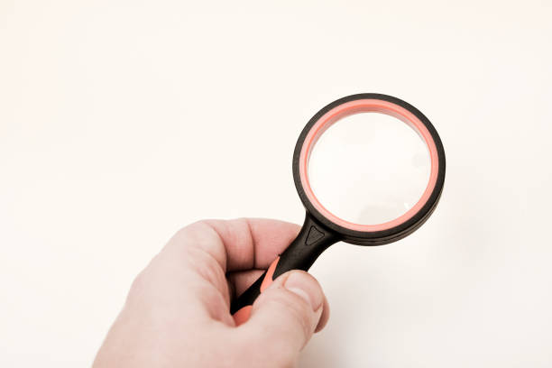 Magnifying glass on a white background. A magnification device for the visually impaired.