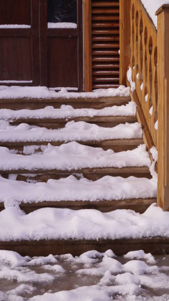 istock snow covered wooden house 2203286932