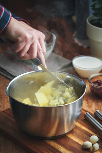 Trending Food - Nordic Diet: Preparing Mashed Potatoes in Domestic Kitchen