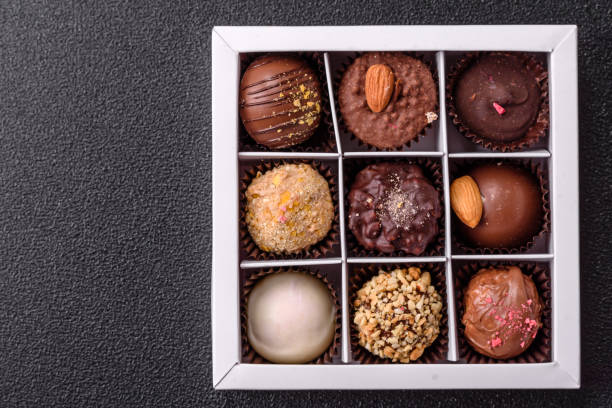 istock Homemade chocolate candies with different fillings and sprinkles 2203288005