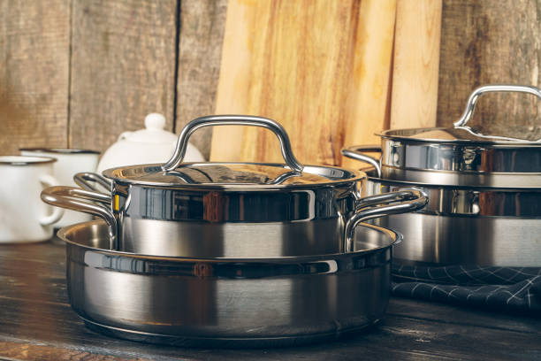 istock Set of dishware against old wooden background 2203288024