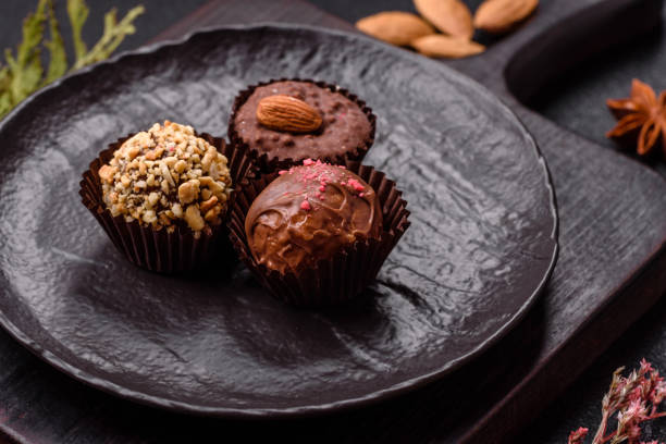 istock Homemade chocolate candies with different fillings and sprinkles 2203288262
