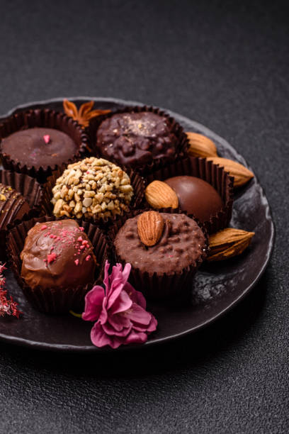 istock Homemade chocolate candies with different fillings and sprinkles 2203288413