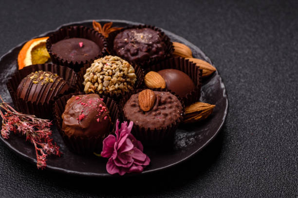 istock Homemade chocolate candies with different fillings and sprinkles 2203289460