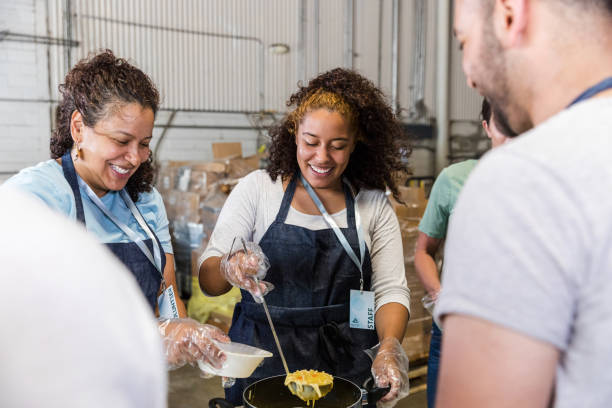 istock Happy Volunteers Serving Food at a Community Kitchen 2203291314