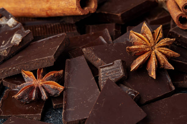 istock chocolate, cocoa, nuts and spices on wooden background 2203294262