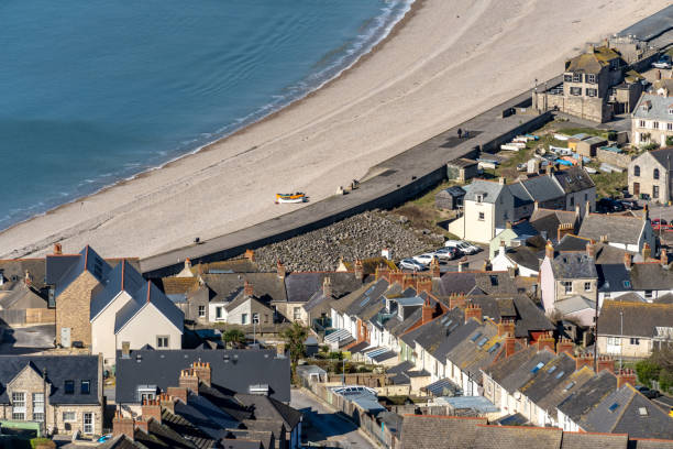 istock Weymouth houses meet Chesil Beach 2203295911