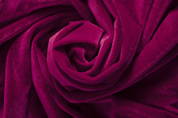 Twisted purple satin fabric background.