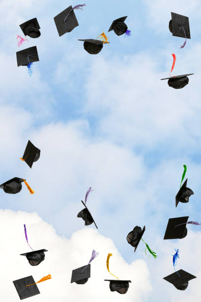 istock Graduation caps thrown in the sky 2203301249