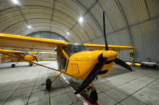 istock Yellow airplane glider in the hangar. 2203301942