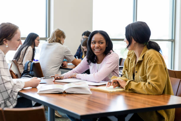 istock Happy Diverse Students Studying Together in a Classroom 2203305673