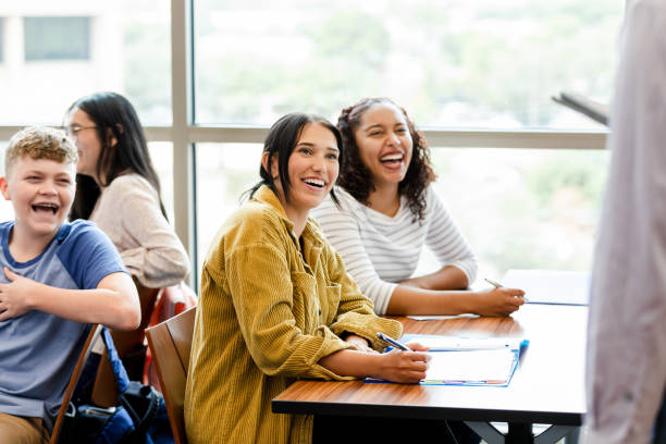 istock Happy Diverse Students Laughing in Classroom Seminar 2203305740