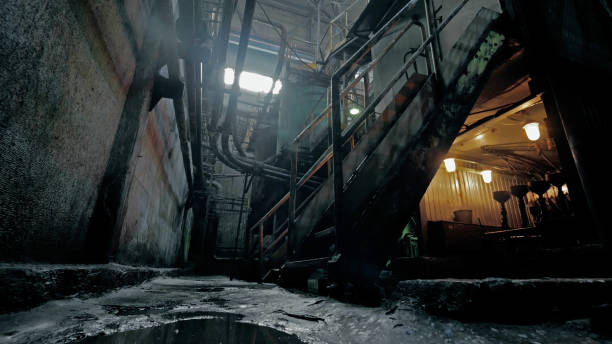 istock Abandoned industrial interior in dark colors with glowing lights 2203310899