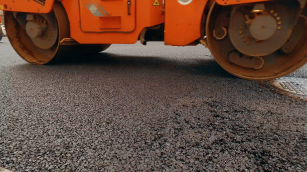 istock Heavy asphalt road roller with heavy vibration roller compactor that press new hot asphalt 2203312044