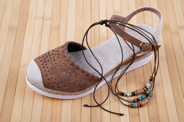 A pair of vintage Y2K chunky shoes and heart shaped glasses isolated on white.