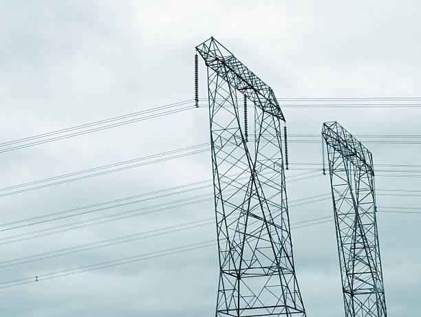 istock Low Angle View of Two Electricity Pylons 2203316782