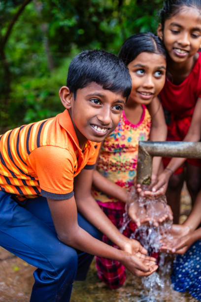 istock Sri Lankan children drinking a water, Ceylon 2203321299
