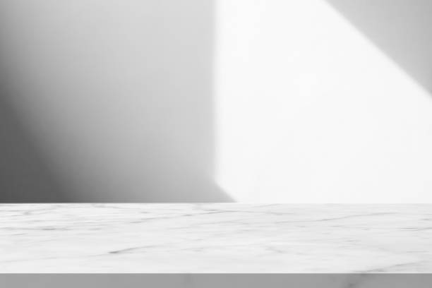 istock Marble table with window shadow drop on white wall background for mockup product display 2203321864