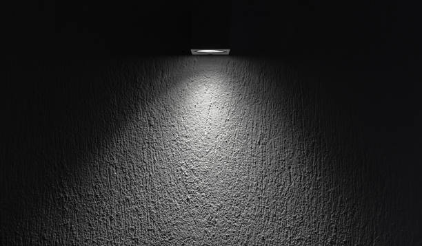 istock Soft spot light beam highlighting a textured wall, abstract background 2203332562
