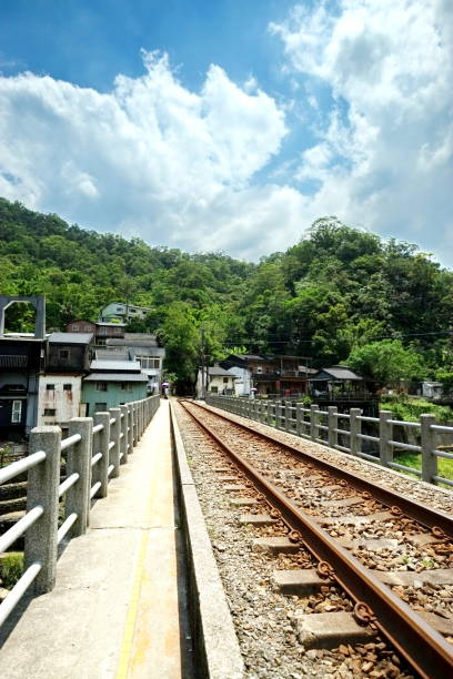 istock Railway Track Passing Through a Rural Mountain Village 2203333104