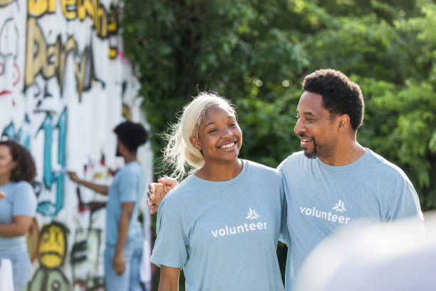 istock Happy Volunteers Working Together at Community Mural Project 2203334132