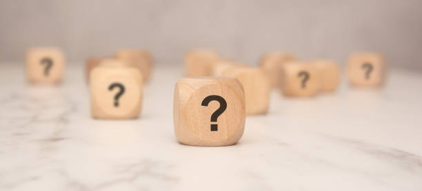 istock Wooden block with a question mark symbol, symbolizing uncertainty or decision-making 2203336233