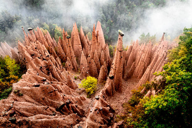 Earth Pyramids pinnacles in the mist, Renon in Ritten, Trentino-South Tyrol, Italy