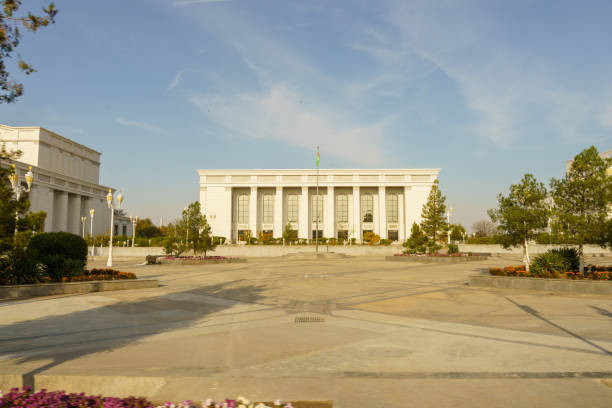 A large white building with a green flag on top in Ashgabat, Ashgabat, Turkmenistan