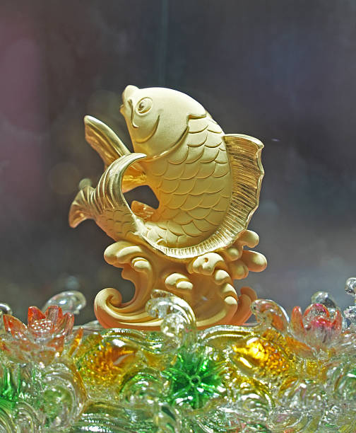 istock Chinese ancient gold  koi fish statue with jade water. 2203344802