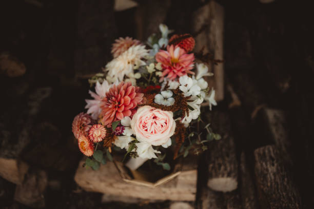 istock Bride's wedding bouquet with autumn colored flowers 2203344810