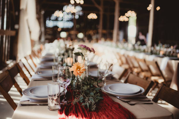 istock Wedding reception table set up with flowers and candles 2203347087