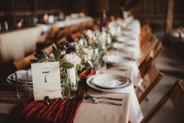 istock Wedding reception dinner table set up with flowers and sheer table runner 2203347105