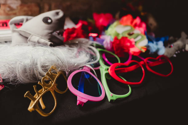 Bright colored Photo Booth props on a table at wedding reception