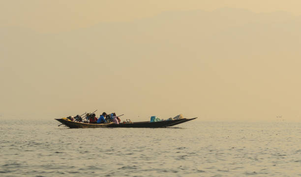 istock Wooden boat on Inle Lake, Myanmar 2203353700